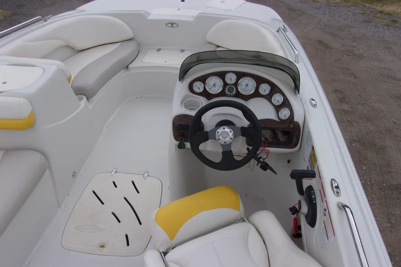Slide: The Image of 2009 Tahoe 195 I/O boat interior with steering wheel and dashboard gauges. - 5