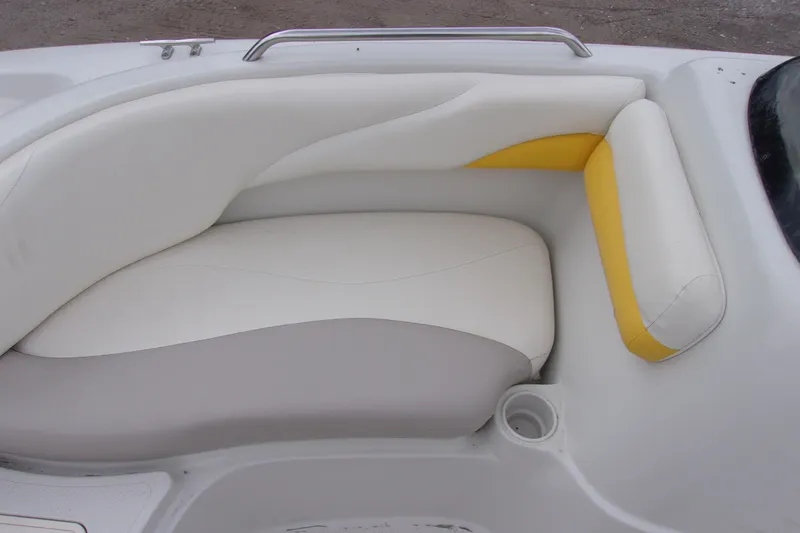 Slide: The Image of 2009 Tahoe 195 I/O boat interior with white and yellow cushioned seating. - 7