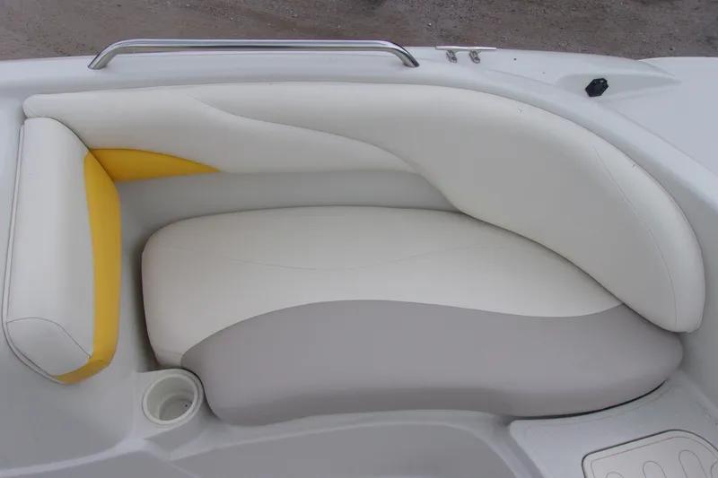 Slide: The Image of 2009 Tahoe 195 I/O boat interior with white, yellow, and gray cushioned seating. - 8