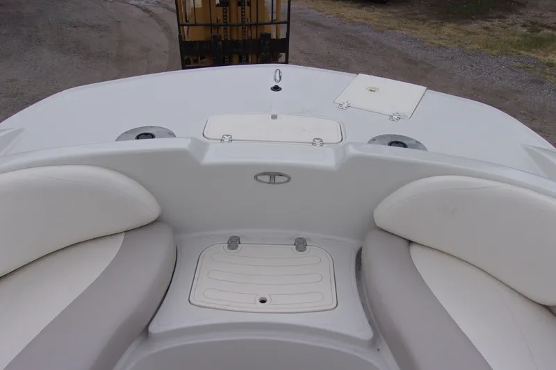 Slide: The Image of 2009 Tahoe 195 I/O boat interior with white seating and storage compartments. - 9