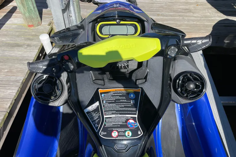 Slide: The Image of 2020 Sea-Doo Wake Pro 230 dashboard with controls and safety instructions. - 7