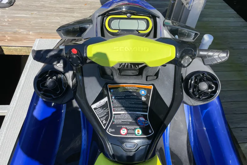 Slide: The Image of 2020 Sea-Doo Wake Pro 230 dashboard with controls and display, docked on wooden pier. - 9