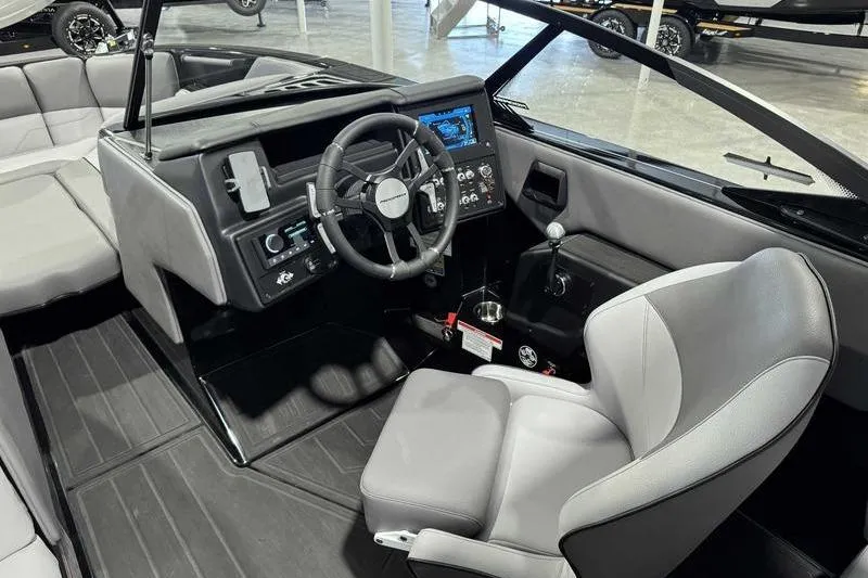Slide: The Image of 2026 Moomba Max boat interior with modern dashboard and steering wheel. - 14