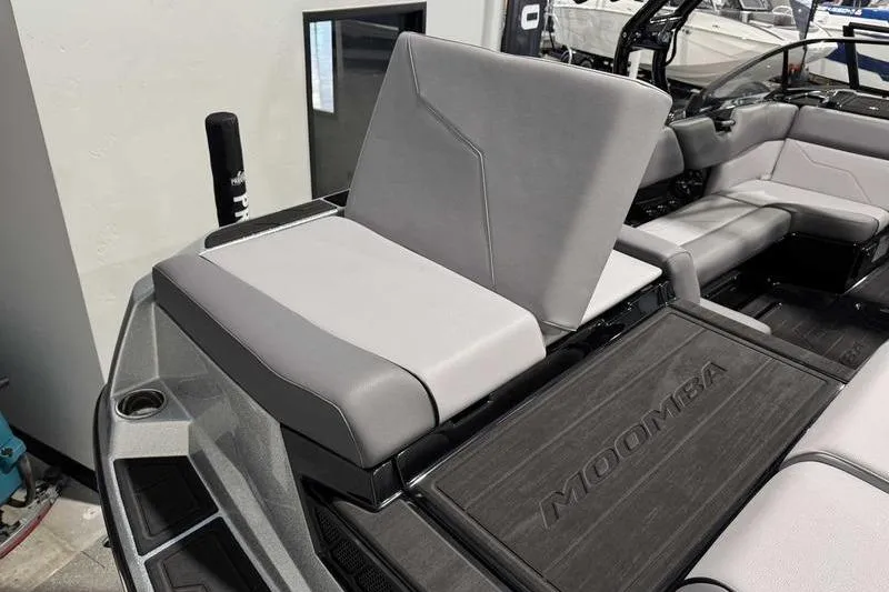 Slide: The Image of 2026 Moomba Max boat interior with gray seating and Moomba branding. - 3