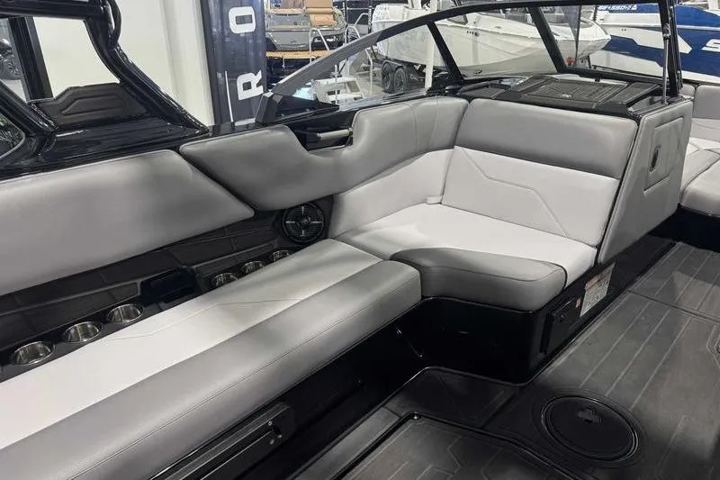 Slide: The Image of 2026 Moomba Max boat interior with sleek gray seating and modern design. - 6