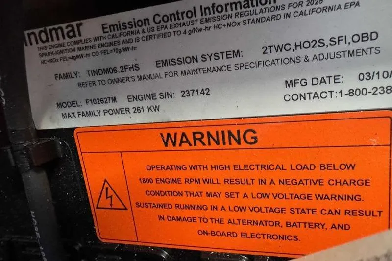 Slide: The Image of 2026 Moomba Max engine warning label with emission control and electrical load caution. - 8