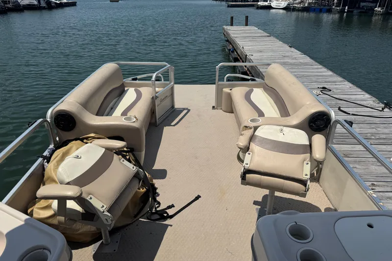 Slide: The Image of 2006 Sun Tracker 240 Party Barge pontoon boat docked on a sunny day. - 4