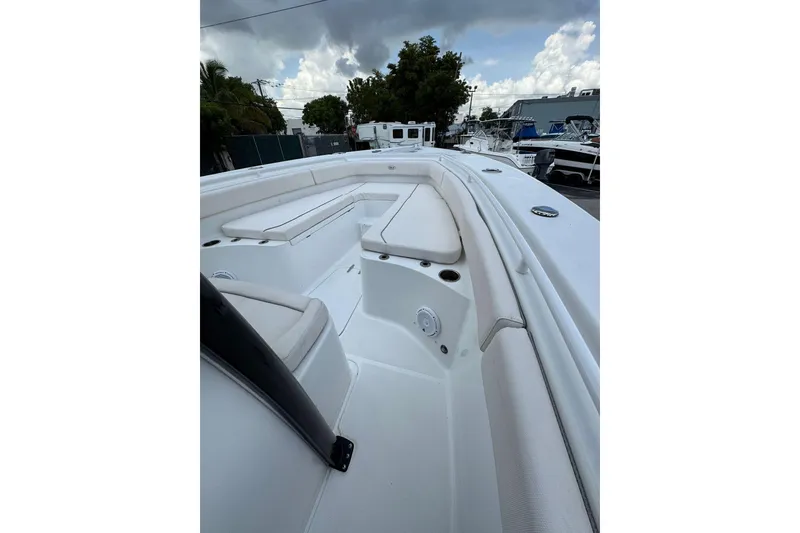 Slide: The Image of 2023 Sea Hunt Gamefish 27 Forward Seating boat with spacious white interior. - 21