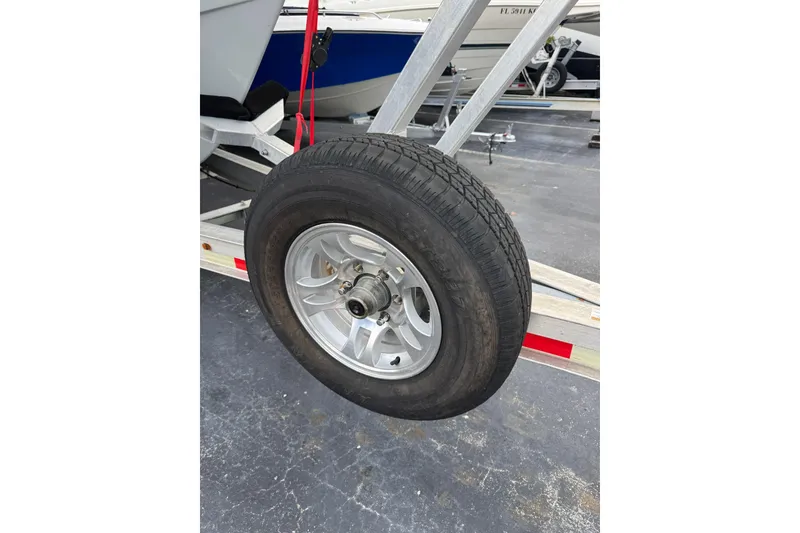 Slide: The Image of Trailer wheel of 2023 Sea Hunt Gamefish 27 Forward Seating boat. - 22