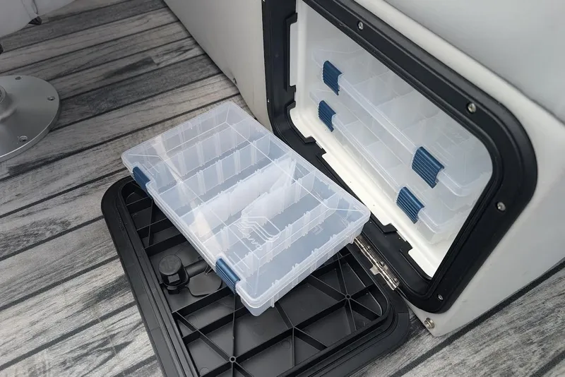 Slide: The Image of Storage compartment with clear plastic organizer on Qwest LS 822 DS Bar, 2021 model. - 13