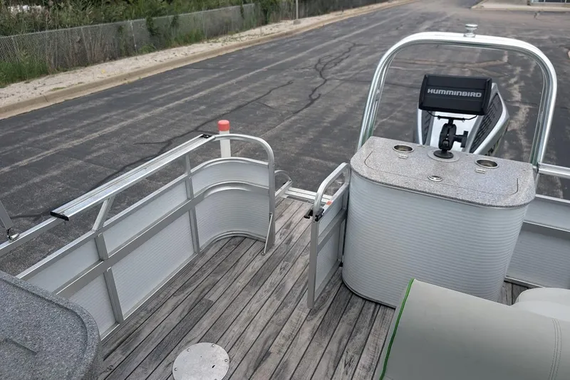 Slide: The Image of 2021 Qwest LS 822 DS Bar boat interior with wood deck and Humminbird device. - 15