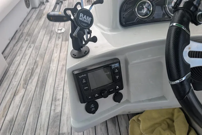 Slide: The Image of Boat dashboard of 2021 Qwest LS 822 DS Bar with RAM mount and Infinity stereo. - 21
