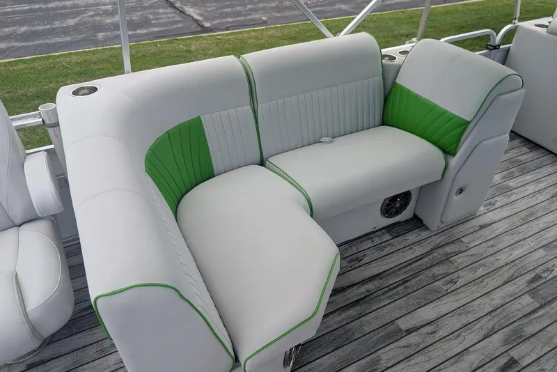 Slide: The Image of 2021 Qwest LS 822 DS Bar boat seating with green accents on wooden deck. - 22
