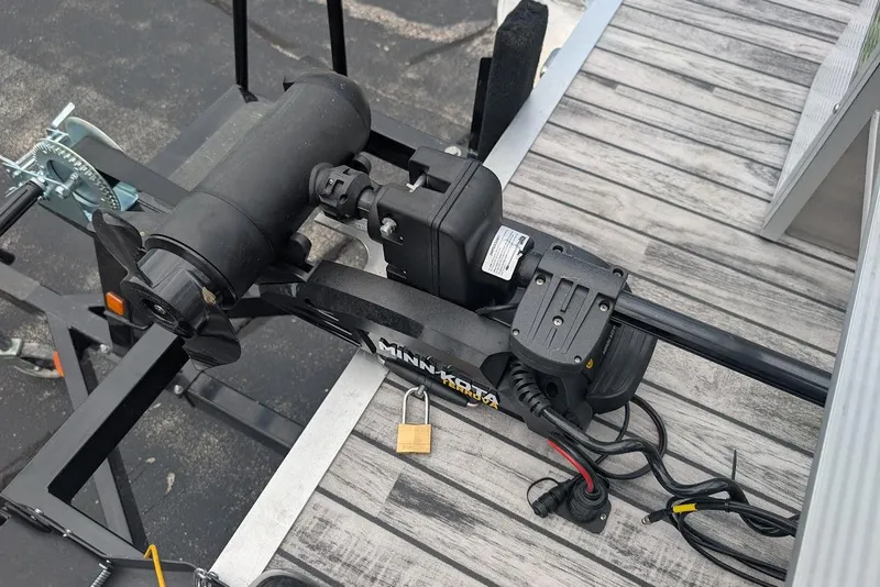 Slide: The Image of Electric trolling motor on a Qwest LS 822 DS Bar boat, 2021 model, secured with a padlock. - 28