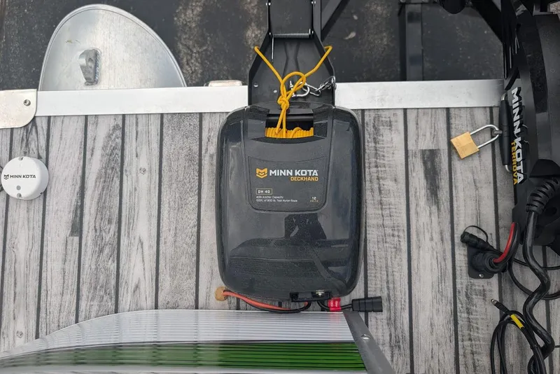 Slide: The Image of Minn Kota Deckhand on Qwest LS 822 DS Bar boat, 2021 model, with wood-patterned deck. - 29