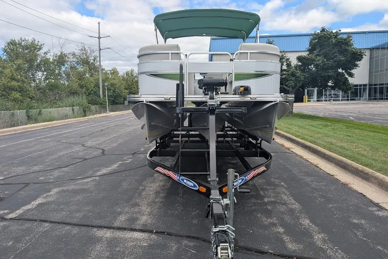 Slide: The Image of 2021 Qwest LS 822 DS Bar pontoon boat on trailer, parked on asphalt road. - 3