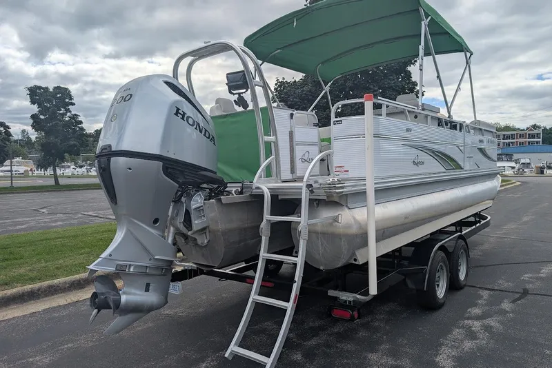 Slide: The Image of 2021 Qwest LS 822 DS Bar pontoon boat with Honda outboard motor on trailer. - 32