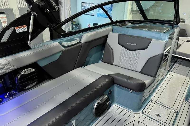 Slide: The Image of 2026 MasterCraft XT23 boat interior with sleek seating and modern design. - 11