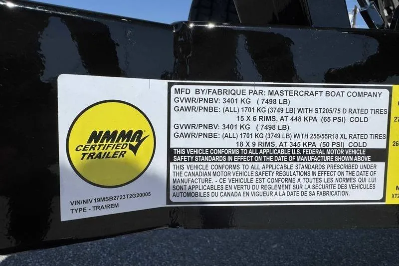 Slide: The Image of 2026 MasterCraft XT23 trailer label with NMMA certification and safety standards information. - 13