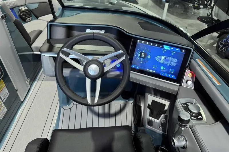 Slide: The Image of 2026 MasterCraft XT23 boat dashboard with touchscreen display and modern steering wheel. - 17