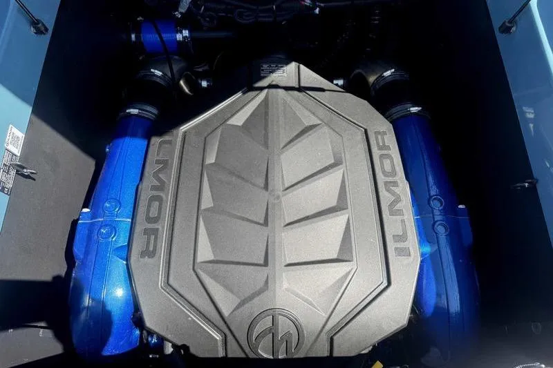 Slide: The Image of 2026 MasterCraft XT23 engine with Ilmor cover, featuring blue components. - 20