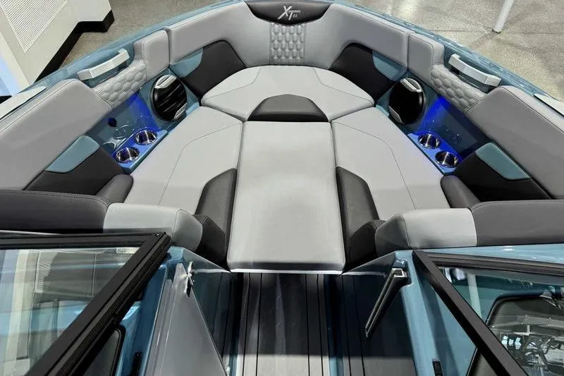 Slide: The Image of 2026 MasterCraft XT23 boat interior with luxurious seating and modern design. - 21