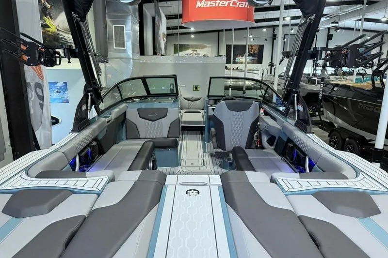 Slide: The Image of 2026 MasterCraft XT23 boat interior with modern seating and sleek design. - 8