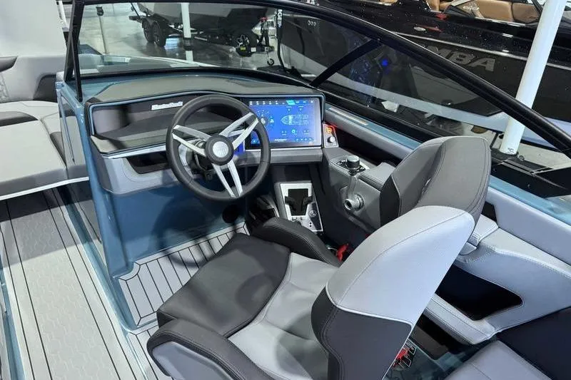 Slide: The Image of 2026 MasterCraft XT23 boat interior with modern dashboard and steering wheel. - 9