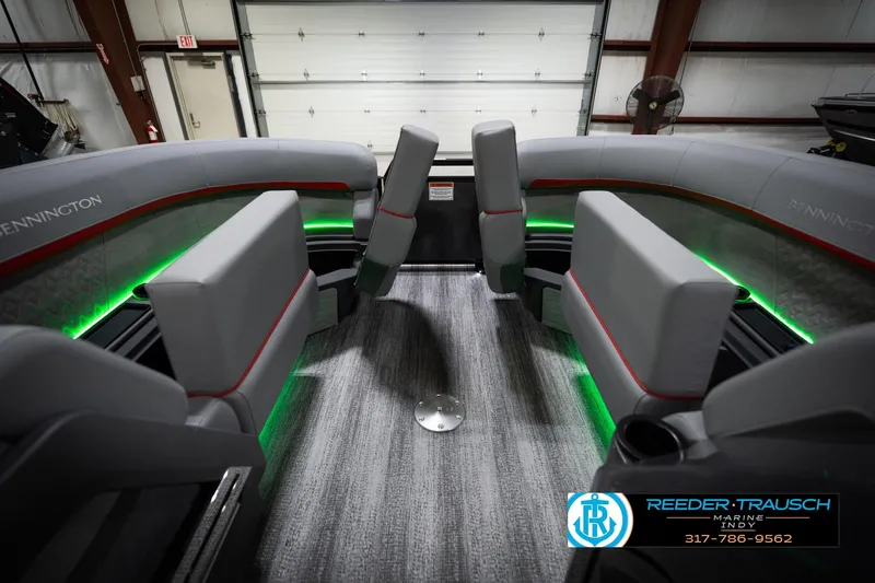 Slide: The Image of Interior of 2026 Bennington 22 MFB boat with modern seating and ambient lighting. - 22