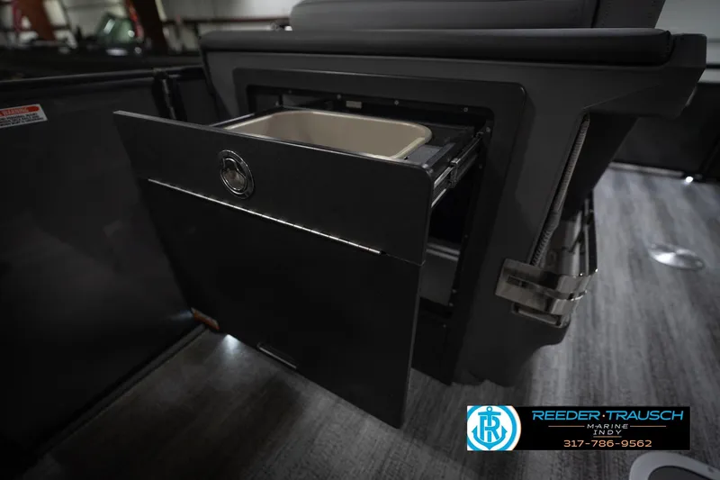 Slide: The Image of 2026 Bennington 22 MFB boat interior with open storage compartment. - 26