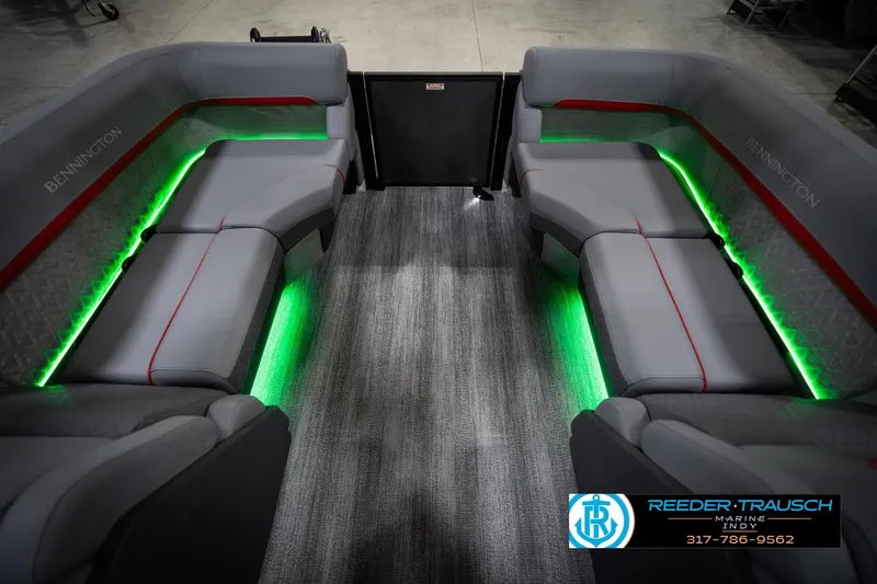 Slide: The Image of 2026 Bennington 22 MFB boat interior with gray seating and green LED lighting. - 28