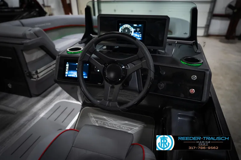 Slide: The Image of 2026 Bennington 22 MFB boat dashboard with steering wheel and digital displays. - 30