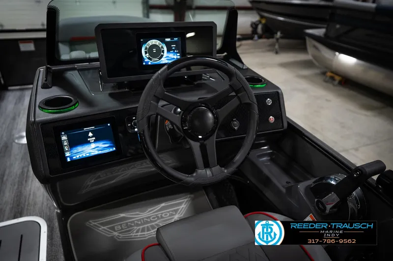 Slide: The Image of Interior view of 2026 Bennington 22 MFB boat dashboard with modern controls and steering wheel. - 31