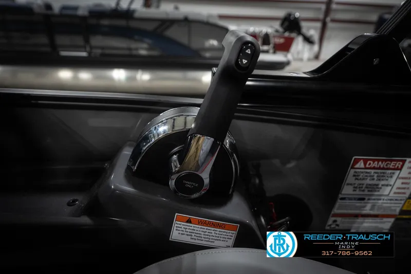 Slide: The Image of Throttle control of 2026 Bennington 22 MFB boat with safety warnings and dealership logo. - 38