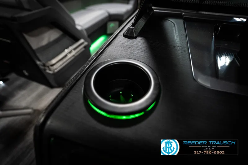 Slide: The Image of 2026 Bennington 22 MFB boat interior with illuminated cup holder and seating. - 47