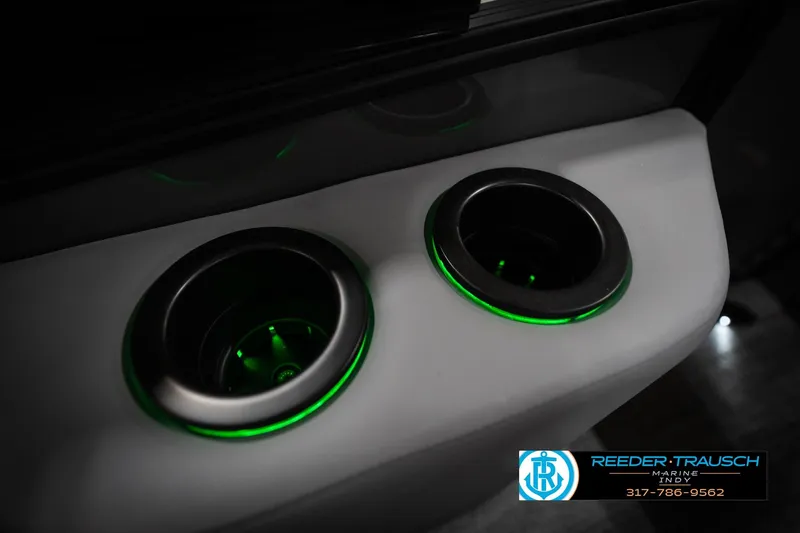 Slide: The Image of Illuminated cup holders on 2026 Bennington 22 MFB boat, featuring green LED lighting. - 48