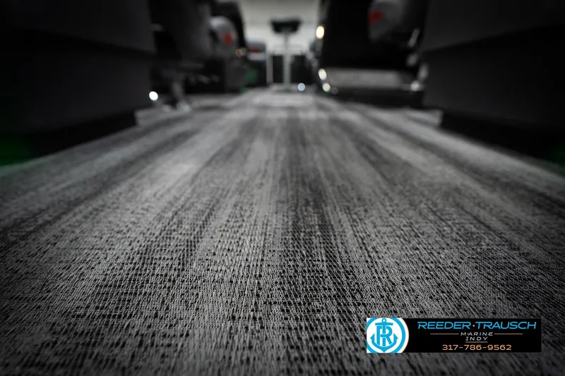 Slide: The Image of Carpeted interior of 2026 Bennington 22 MFB boat, featuring Reeder-Trausch Marine branding. - 49