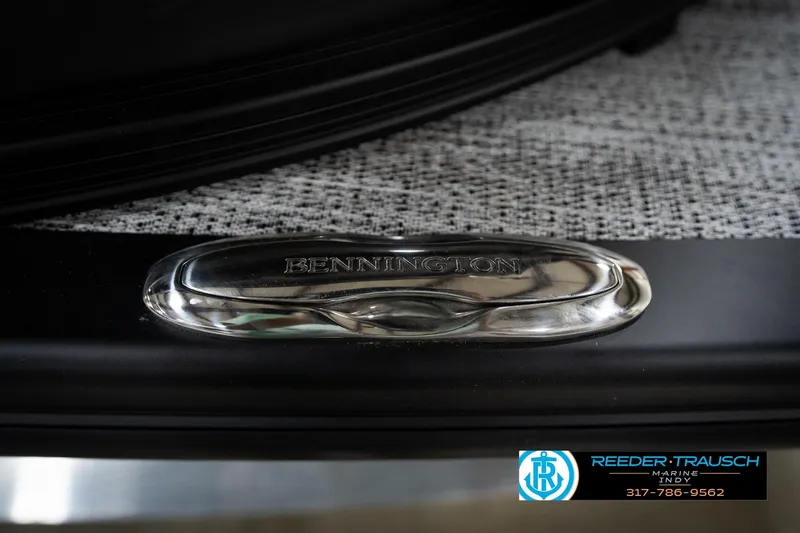 Slide: The Image of Close-up of 2026 Bennington 22 MFB boat emblem on textured surface. - 55