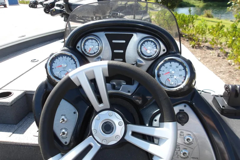 Slide: The Image of Dashboard of 2022 Tracker Pro Team 190 TX Tournament Edition boat with gauges and controls. - 8