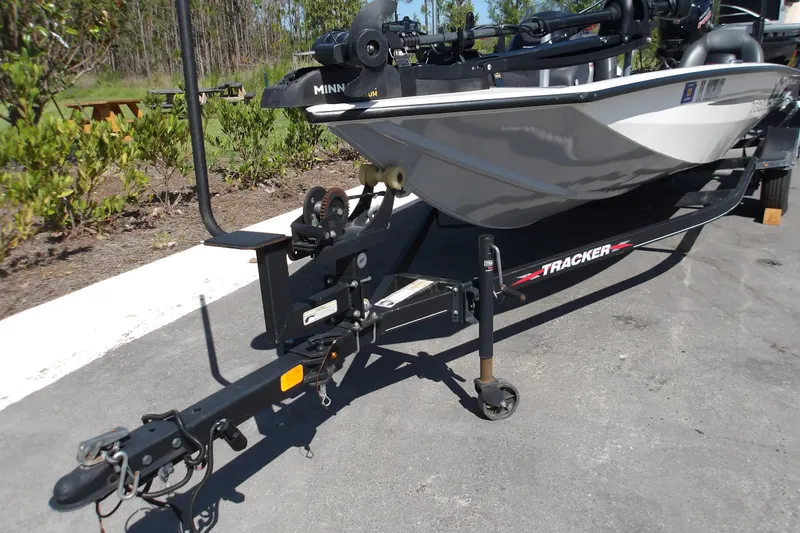 Slide: The Image of 2022 Tracker Pro Team 190 TX Tournament Edition boat on trailer, parked outdoors. - 9