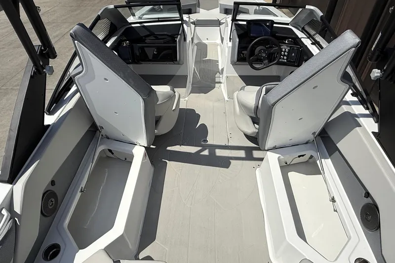 Slide: The Image of 2026 Scarab 235 SE boat interior with modern seating and dashboard design. - 13