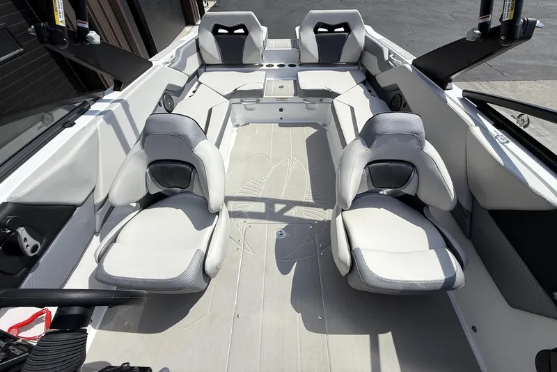 Slide: The Image of 2026 Scarab 235 SE boat interior with modern seating and sleek design. - 14