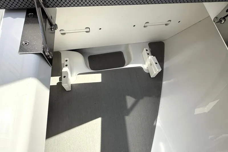 Slide: The Image of 2026 Scarab 235 SE boat interior detail with seating and hardware components. - 15