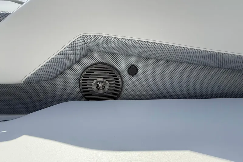 Slide: The Image of Interior speaker detail of 2026 Scarab 235 SE boat with textured paneling. - 18