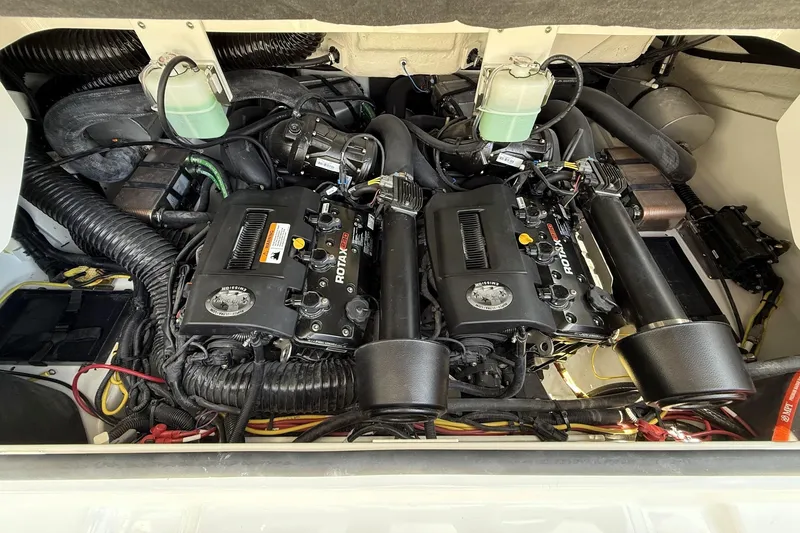 Slide: The Image of Engine compartment of 2026 Scarab 235 SE with dual Rotax engines. - 23