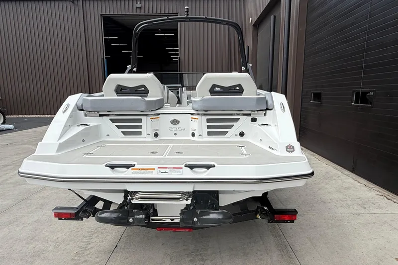 Slide: The Image of 2026 Scarab 235 SE boat rear view, showcasing sleek design and modern features. - 3