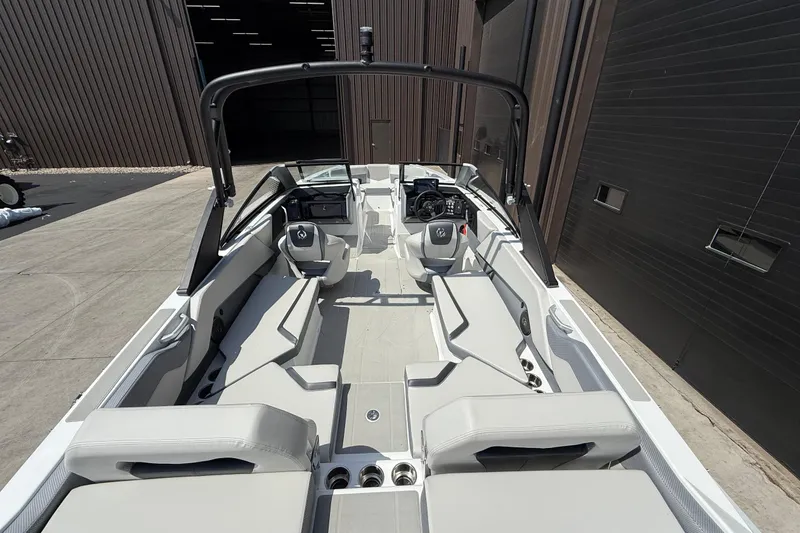 Slide: The Image of 2026 Scarab 235 SE boat interior with sleek seating and modern dashboard design. - 5