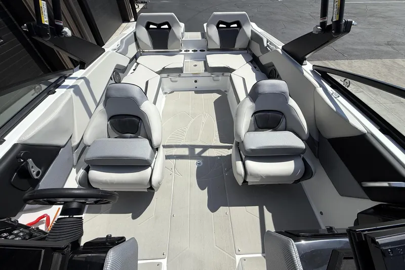 Slide: The Image of 2026 Scarab 235 SE boat interior with modern seating and sleek design. - 6