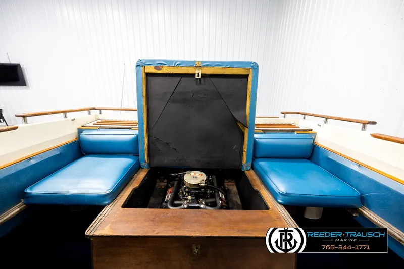Slide: The Image of 1977 Searay 220 OV boat interior with blue seating and exposed engine compartment. - 21