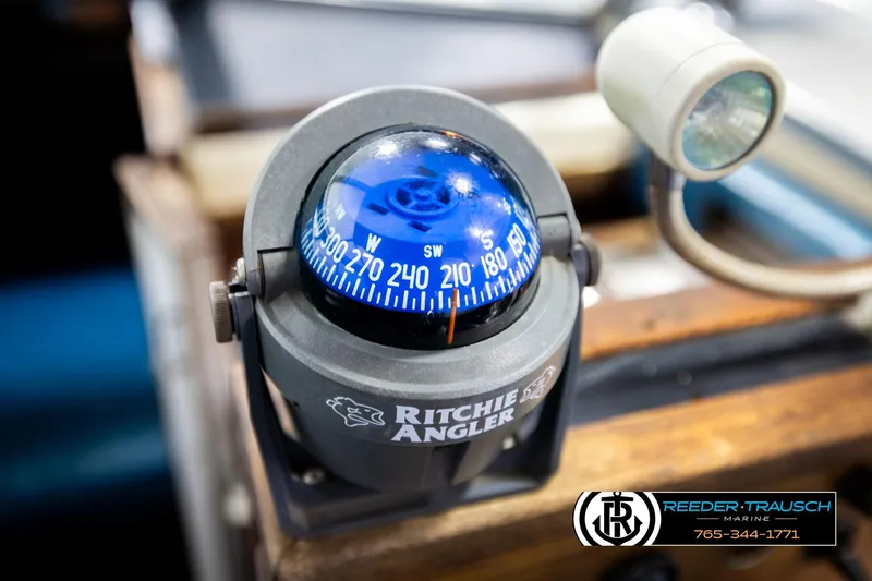 Slide: The Image of Ritchie Angler compass on 1977 Searay 220 OV boat dashboard, with marine light. - 35